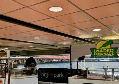 Concession Stand Area Under Stadium Seating with a Sign Reading Loaded Lemonade